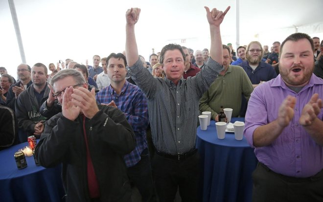 Baumgartners turn over Paper Machinery to surprised employees